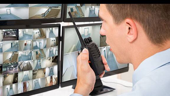 Security officer monitoring cctv footage