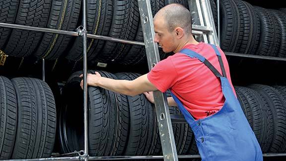 Technician inspecting a tyre