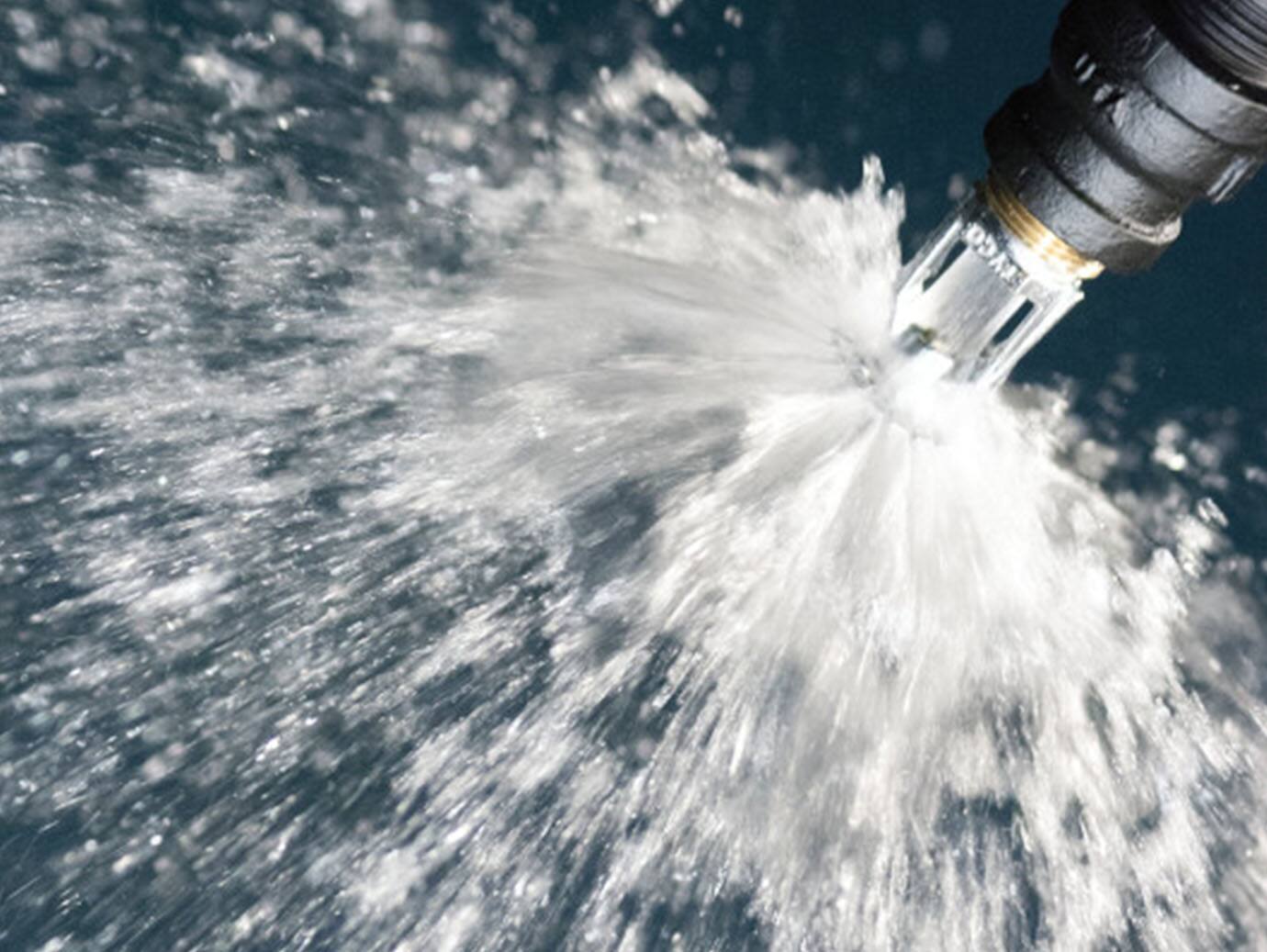 Close-up of an activated water-based sprinkler