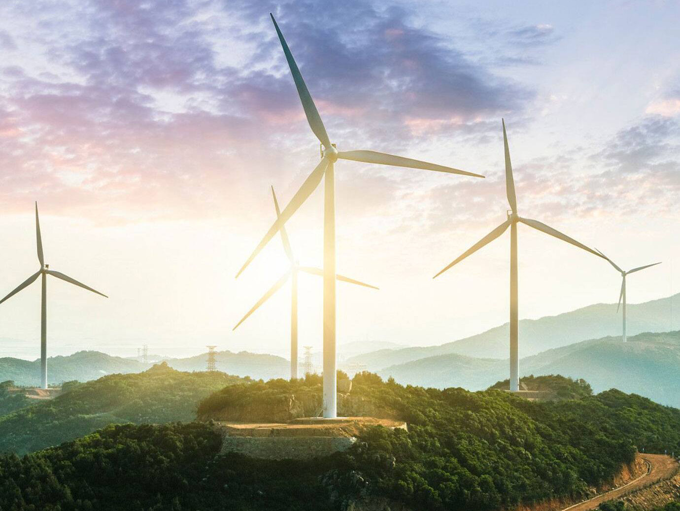 Group of windmills in a hilly area with valleys