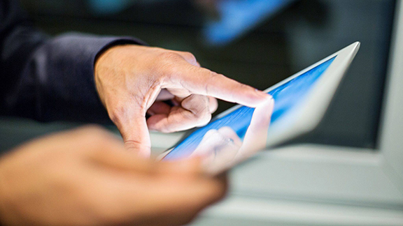 Close-up of a person using a tablet