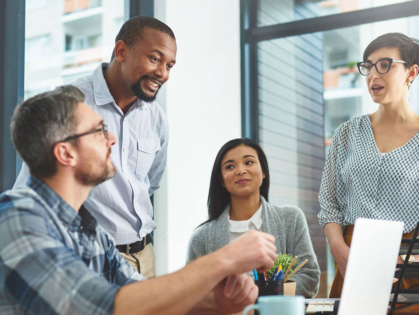 Group of employees having a meeting in office