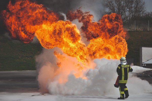 man with fire extinguisher