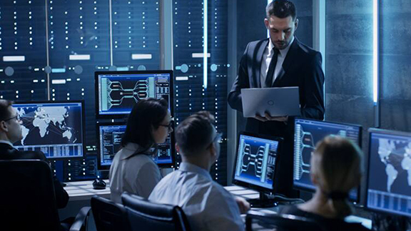 Rear-view image of security officers monitoring cctv footage