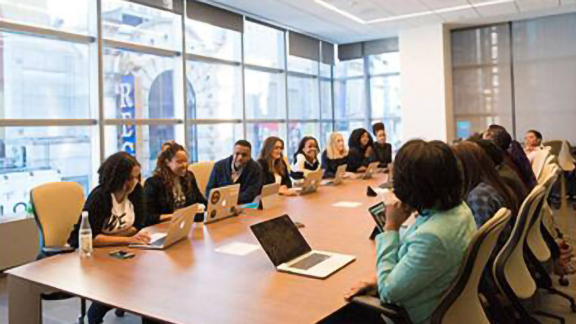 Group of employees having a meeting in an office room