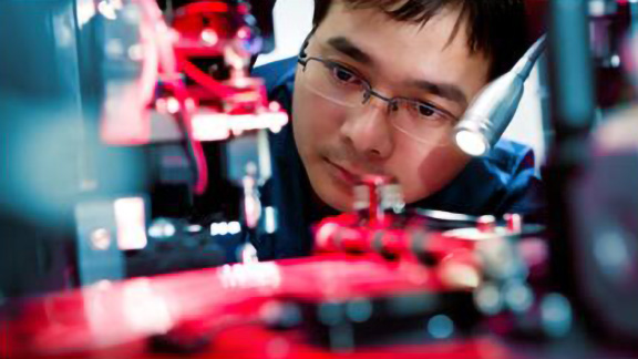Mechanic working on the motherboard of a machine