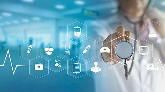 Doctor pointing his stethoscope at a smart screen with an overlay of health icons
