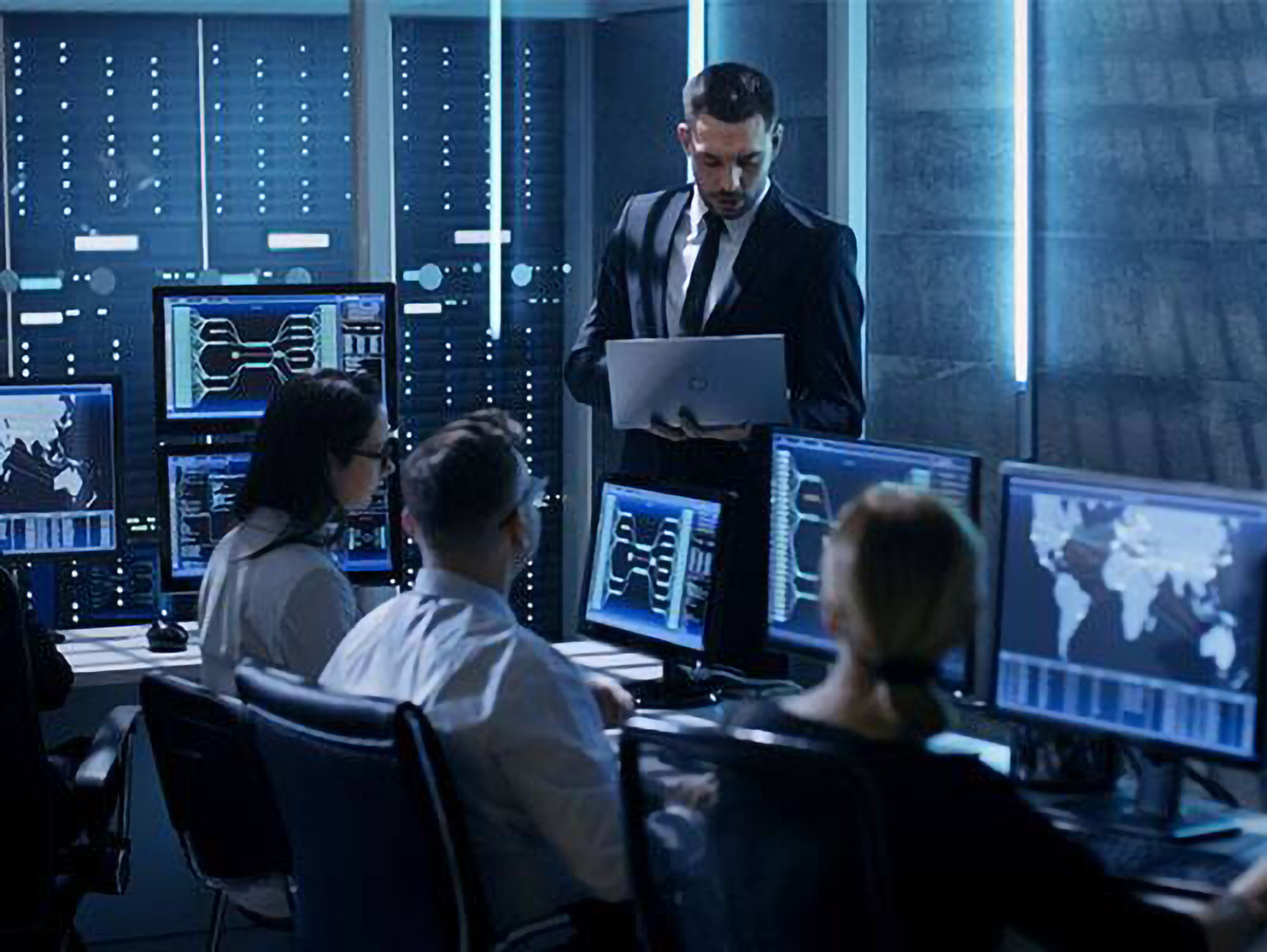 Group of colleagues attending a meeting in an office room