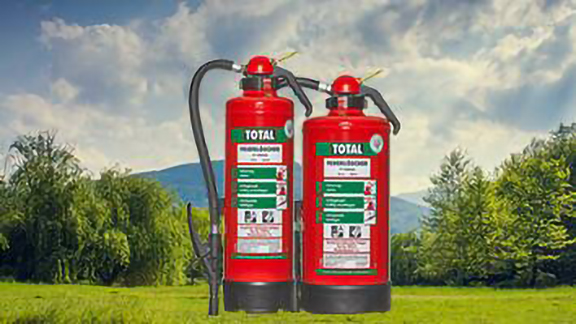 Total fire extinguishers overlaid on an image of a valley surrounded by hills