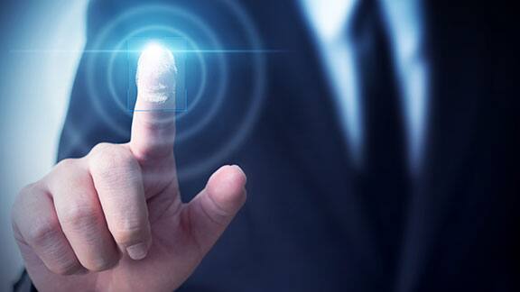 Close-up shot of a person's finger touching a smart screen