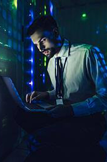 Security officer speaking on his device while checking cctv footage