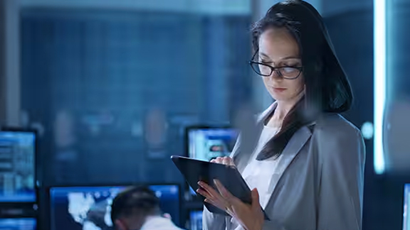 Woman in business formals working on a tablet 