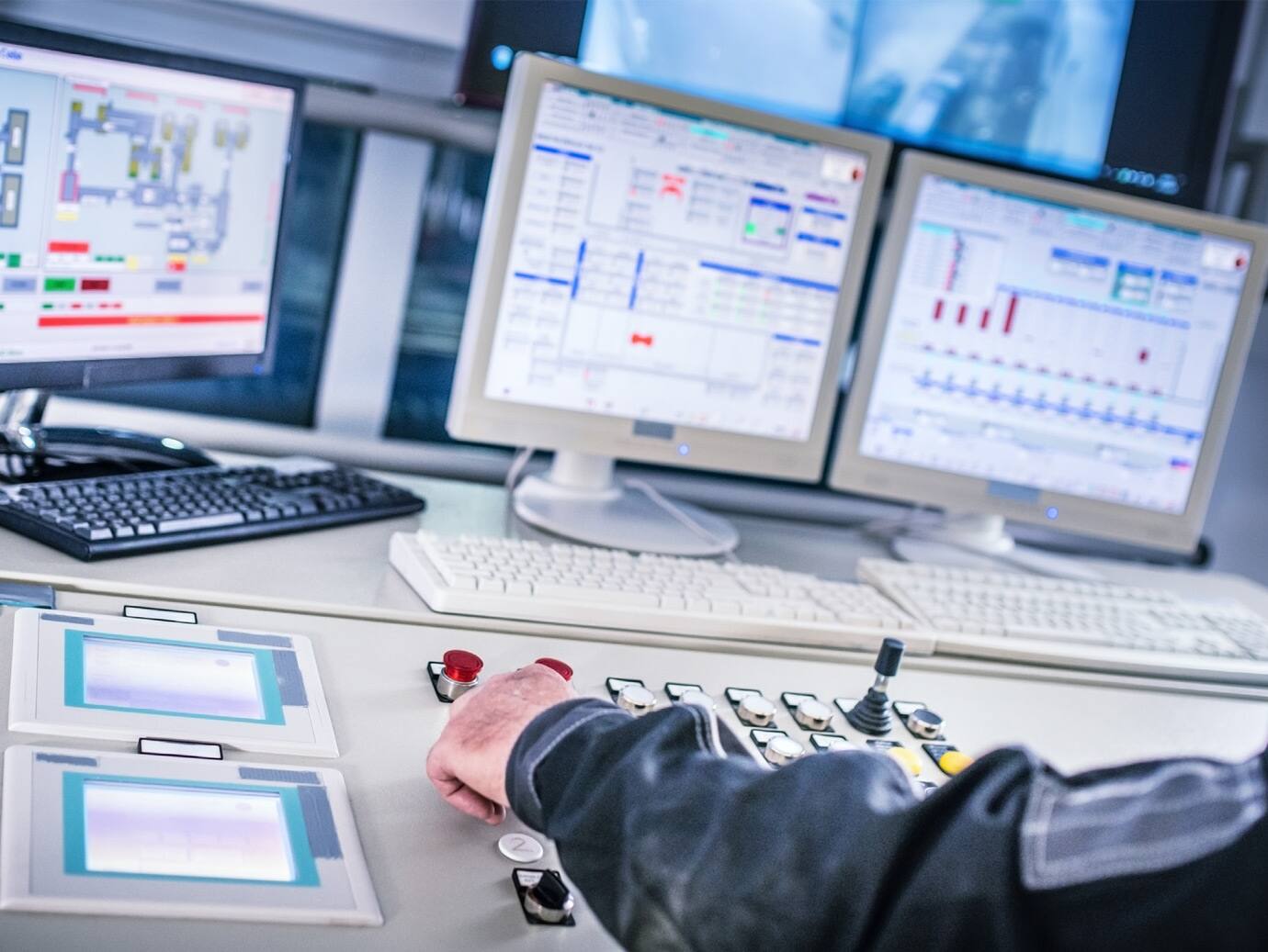 Close-up of a hand operating a control panel