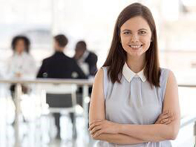 A girl is posing for a photo in a cafetaria