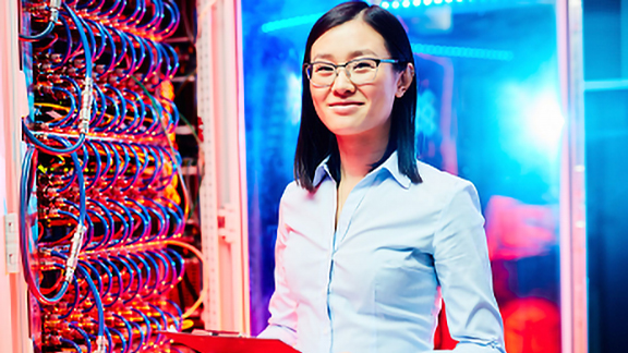Lady technician working on board with wires