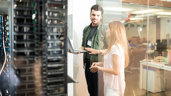 Two technician discussing about work with a laptop