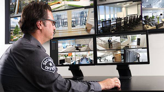 A security personnel monitoring the cctv camera footages