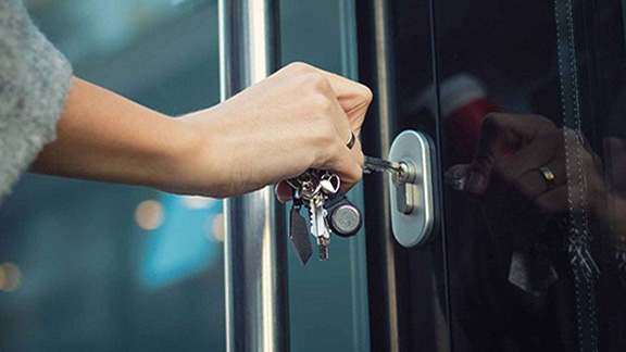 Close-up of a lady opening the door