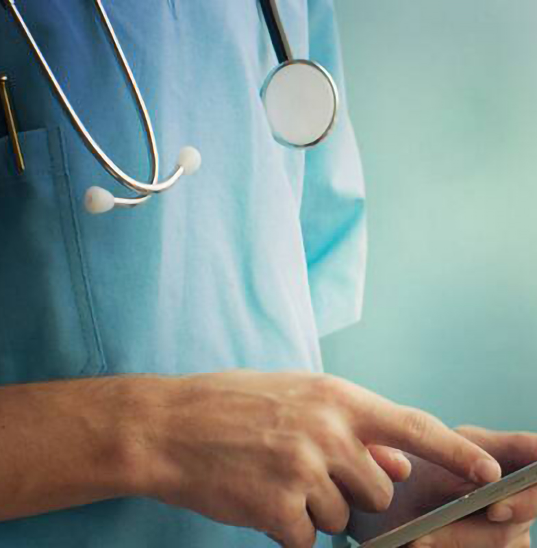 A doctor using a tablet to work on