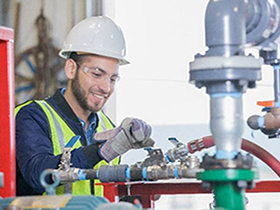 Man is smiling and working