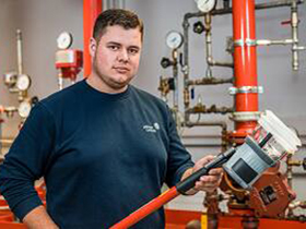 Man looking at camera and working