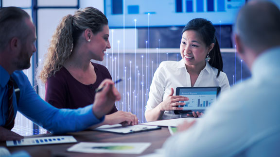 Employees discussing work in a meeting room